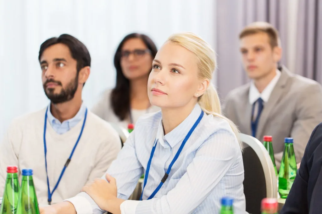 attendees-listen-attentively-at-a-corporate-confer-2026-10-06-20-01-56-utc (1)